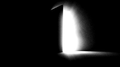 stock-footage-a-black-door-opening-and-letting-in-white-light